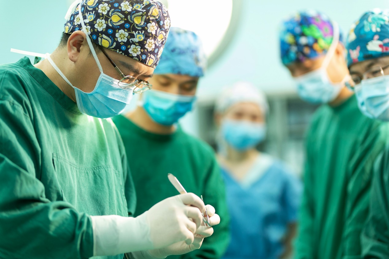 A group of doctors standing around each other